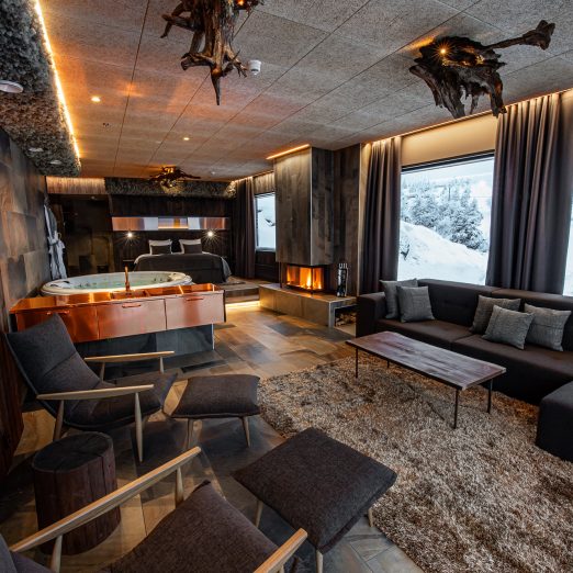 Hotel Iso-Syöte Bear Cave Suite Karhunpesä-sviitti takka tulisija fireplace vuode maisema